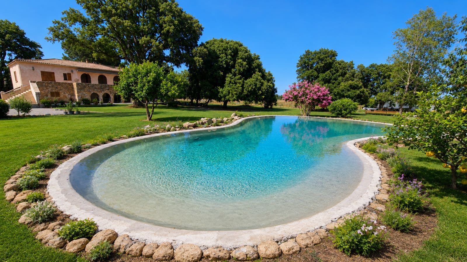 The pool, gardens and stone house at Domaine A FONTE